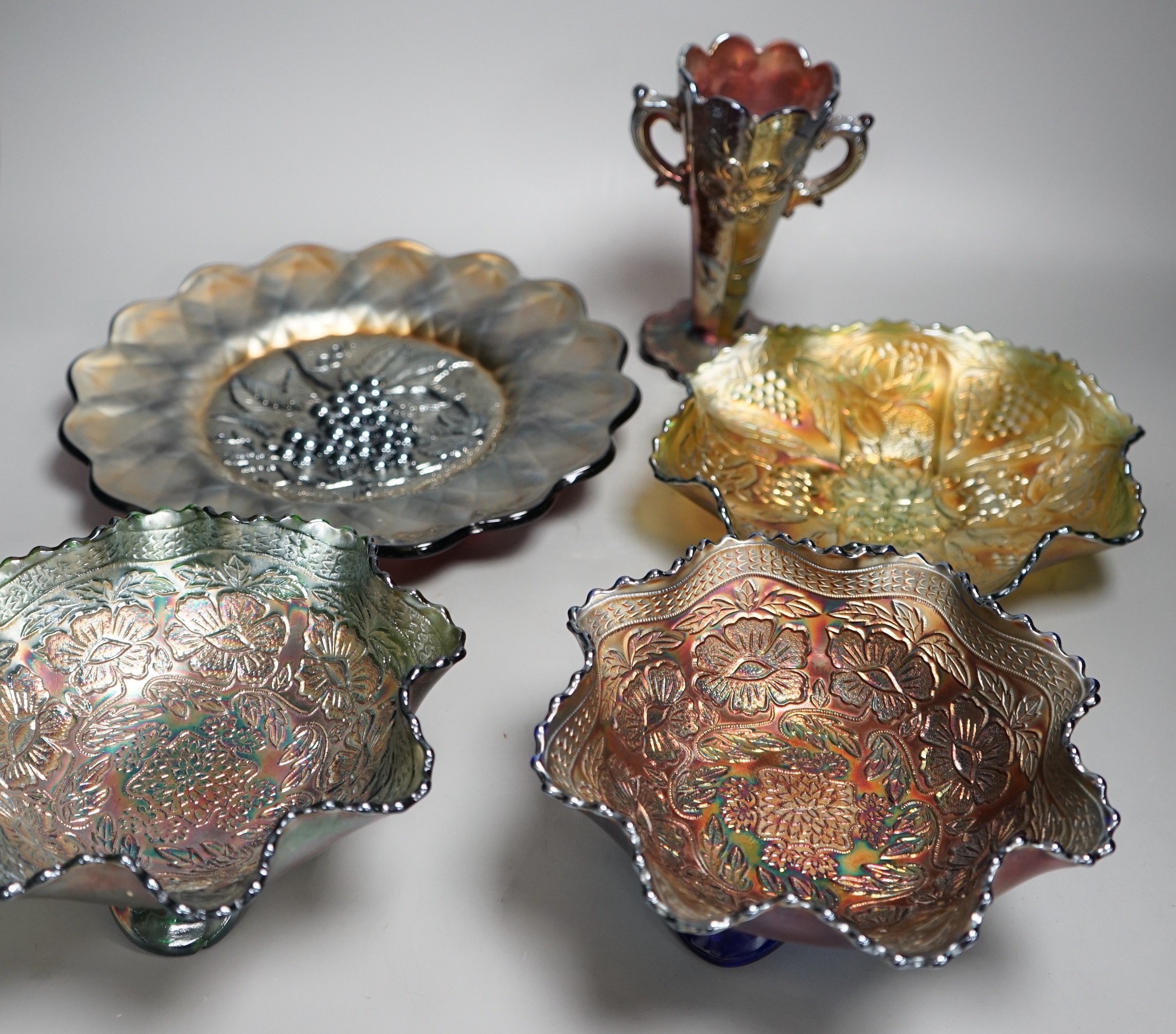 A group of four American Carnival glass dishes and a two handled vase (5), largest dish 28cms diameter